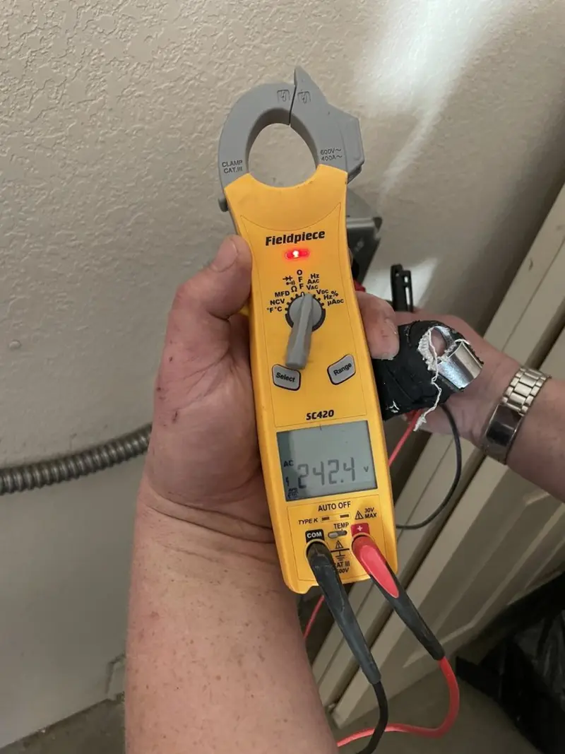 Voltage testing with clamp meter during Generator Installation in Warm Beach